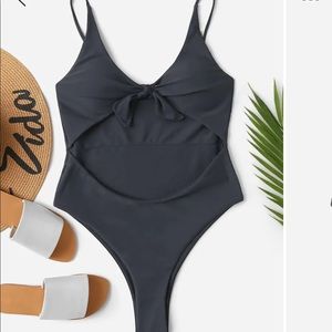 Never worn one piece open front bathing suit